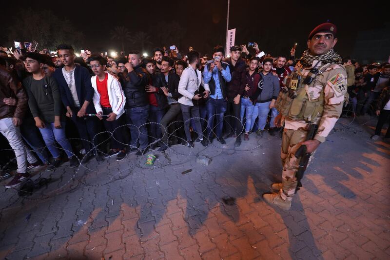 An Iraqi soldier stands guard as Iraqis celebrate the New Year in Baghdad.  AFP