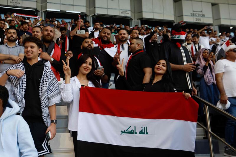 Iraq fans cheer during the Qatar 2023 AFC Asian Cup Group D match between Iraq and Vietnam. AFP