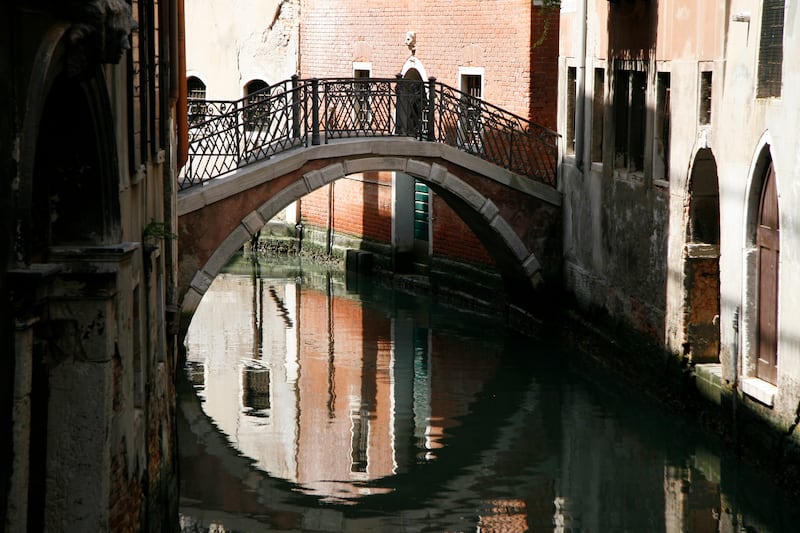 Small walkways and bridges are dotted about the Italian city. Photo: John Brunton