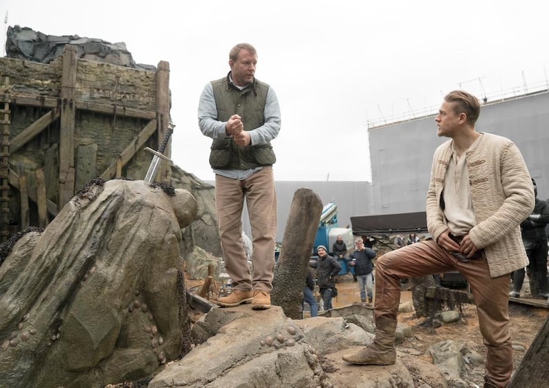  Director Guy Ritchie, left, with Charlie Hunnam on the set of King Arthur: Legend of the Sword. Courtesy Daniel Smith / Warner Bros Pictures.