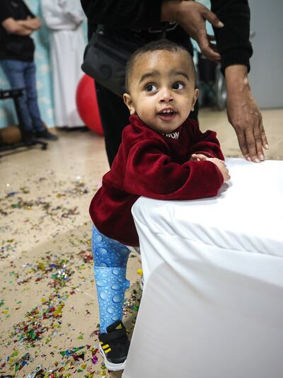 One-year-old Rakan Saif stands for the first time after receiving a prosthetic limb at Emirates Humanitarian City in Abu Dhabi. Victor Besa / The National