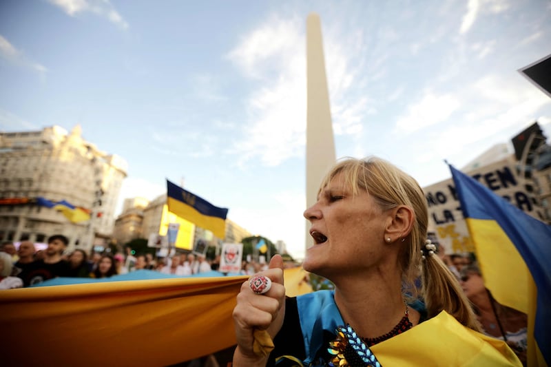 Pro-Ukraine demonstrators take part in a rally commemorating the second anniversary of the Russian invasion of Ukraine at the Obelisk in Buenos Aires. AFP
