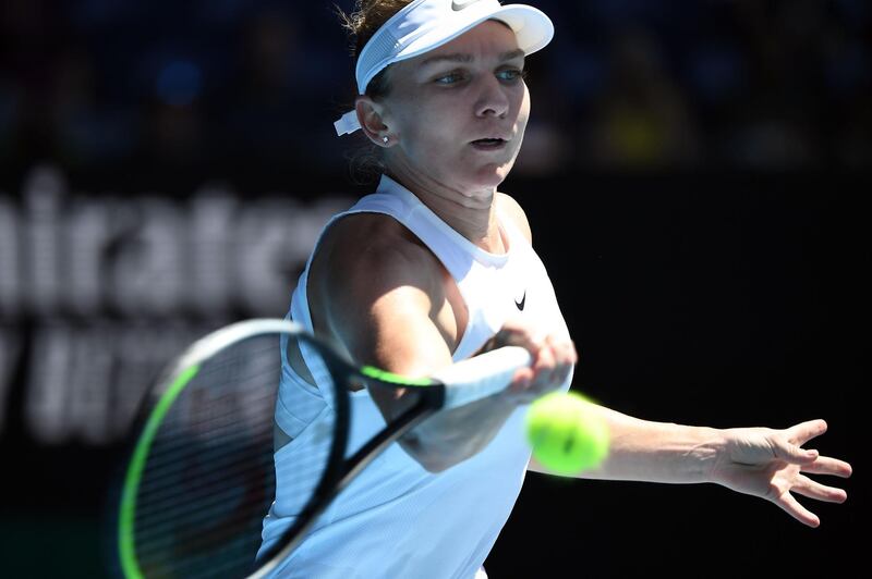 Romania's Simona Halep hits a return against Kazakhstan's Yulia Putintseva during their women's singles match on day six of the Australian Open tennis tournament in Melbourne on January 25, 2020. IMAGE RESTRICTED TO EDITORIAL USE - STRICTLY NO COMMERCIAL USE
 / AFP / Manan VATSYAYANA / IMAGE RESTRICTED TO EDITORIAL USE - STRICTLY NO COMMERCIAL USE
