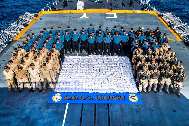 Members of HMCS CALGARY stand with 1286kg of heroin seized from a dhow during a counter-smuggling operation on 23 April, 2021 in the Arabian Sea during OPERATION ARTEMIS and as part of Combined Task Force 150.

Please credit: Corporal Lynette Ai Dang, Her Majesty's Canadian Ship CALGARY, Imagery Technician
©2021 DND/MDN CANADA