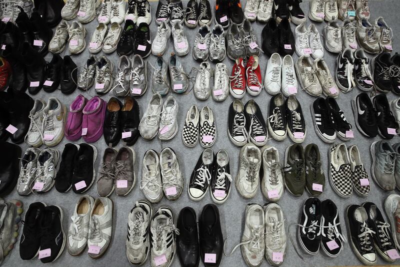 The belongings of victims of a deadly crowd crush are shown at a gym in Seoul, South Korea. One hundred and fifty-one people were killed and at least 150 were injured in Seoul's Itaewon district after huge crowds of people gathered for Halloween parties. Getty Images