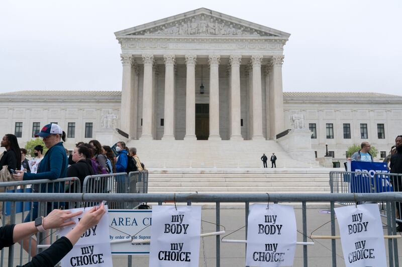 Demonstrators protest outside the US Supreme Court Tuesday, May 3, 2022 in Washington. AP