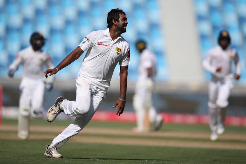 Sri Lanka's bowler Dilruwan Perera celebrates the dismissal of Pakistan's Sarfaraz Ahmed during their last day at Second Test cricket match against Pakistan in Dubai, United Arab Emirates, Tuesday, Oct. 10, 2017. (AP Photo/Kamran Jebreili)