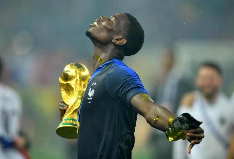 FILE PHOTO: Soccer Football - World Cup - Final - France v Croatia - Luzhniki Stadium, Moscow, Russia - July 15, 2018  France's Paul Pogba holds the trophy as he celebrates winning the World Cup  REUTERS/Dylan Martinez/File Photo