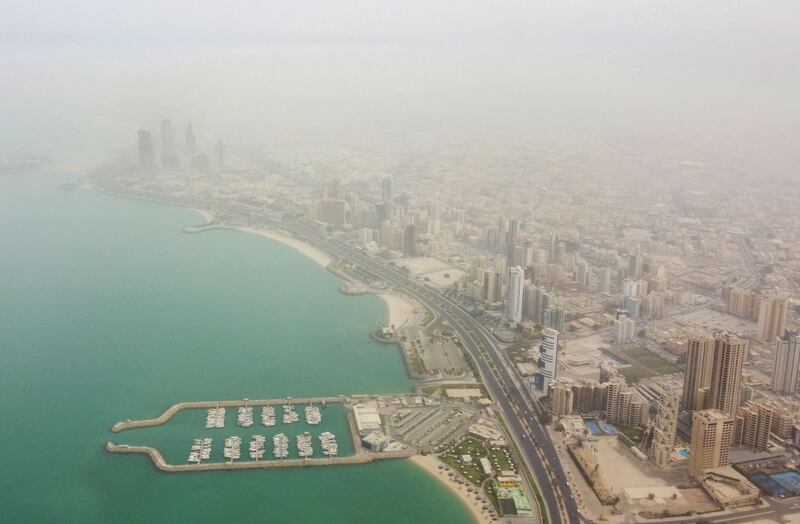 An aerial view shows Kuwait City during a dust storm. AFP