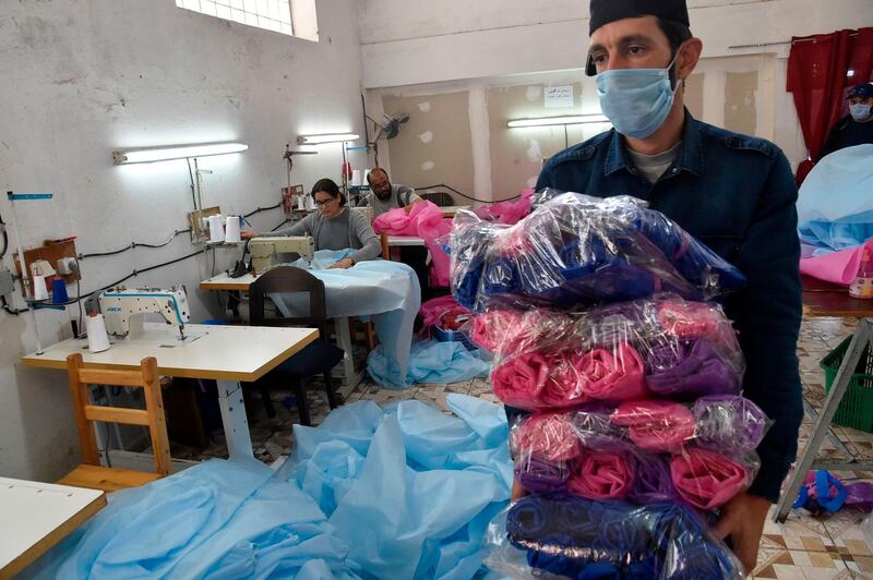 Algerian volunteers prepare personal protection equipment in the capital Algiers.  AFP