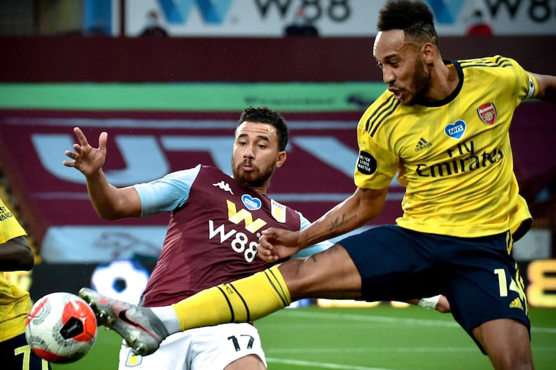 Arsenal's Pierre-Emerick Aubameyang in action against Aston Villa's Trezeguet. EPA