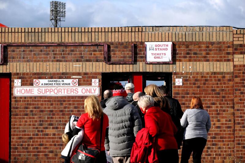 Barnsley fans arrive at the stadium ahead of the Championship playoff semi-final at Oakwell Stadium. PA