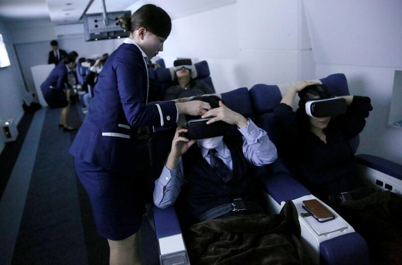 Once landed, staff help passengers put on their VR goggles.