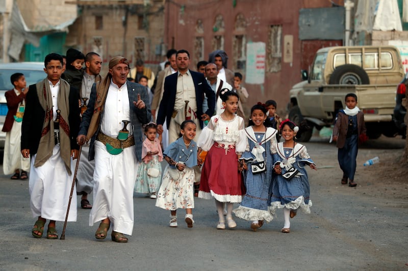 People arrive for Eid al-Fitr prayers outside a mosque in Sana'a, Yemen. EPA