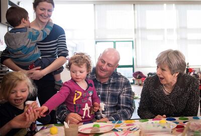 Britain's Prime Minister Theresa May meets a attendees at a local parent and toddler group at Heddon-On-the-Wall, St Andrew's Church of England Primary School in Newcastle, north east England on March 29, 2018, during a tour of the United Kingdom, timed to coincide with one year until the United Kingdom leaves the European Union (Brexit).
British Prime Minister Theresa May will mark the one-year countdown to Brexit on March 29, 2018 with a fast-paced national tour, aiming to unite the UK's four nations. She will take in Scotland, England, Northern Ireland and Wales during her day-long tour, aiming to rally support ahead of Britain's EU departure on 29 March, 2019.
 / AFP PHOTO / POOL / Stefan Rousseau