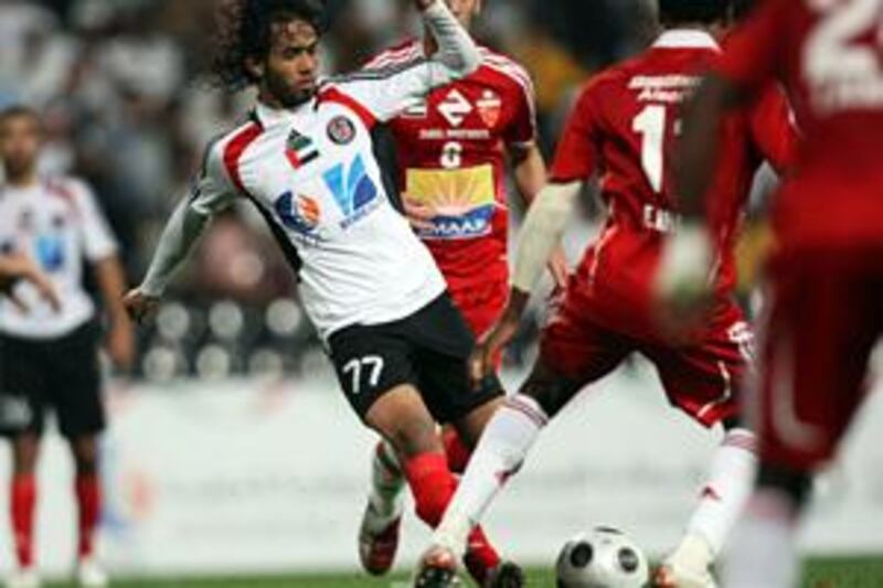Al Jazira's Almenhali tries to break through Al Ahli's defence in Friday's 4-2 defeat.