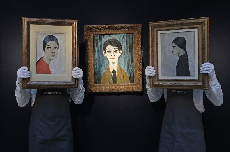 Works by Lowry are displayed by art workers during preparations ahead of the livestreamed Modern British Art Auction at Christie's in London, England. The livestreamed Modern British Art Auction takes place on March 1. Getty Images