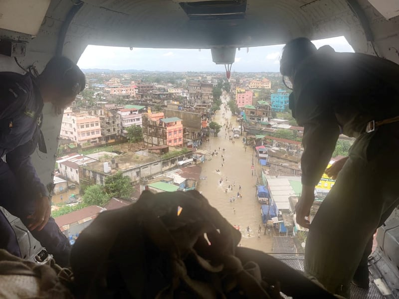 Indian troops drop relief supplies from a plane in Silchar, a town in Assam state affected by floods. Photo: Indian Air Force