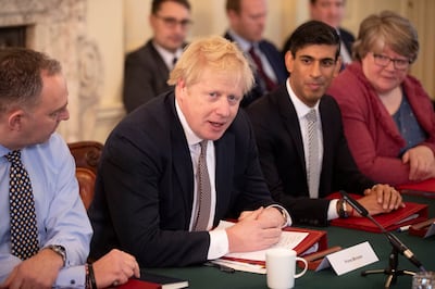 Boris Johnson speaks during his first Cabinet meeting flanked by his then new Chancellor of the Exchequer Rishi Sunak, in London, on February 14, 2020. AP