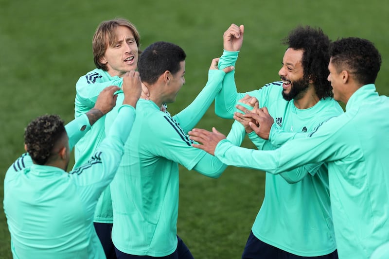 James Rodriguez, Marcelo and Luka Modric share a joke during their training session. Getty