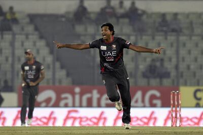 United Arab Emirates cricket captain Amjad Javed celebrates after the dismissal of the Pakistan cricketer  Mohammad Hafeez during the Asia Cup T20 cricket tournament match between Pakistan and United Arab Emirates at the Sher-e-Bangla National Cricket Stadium in Dhaka on February 29, 2016. AFP PHOTO / MUNIR UZ ZAMAN / AFP PHOTO / MUNIR UZ ZAMAN