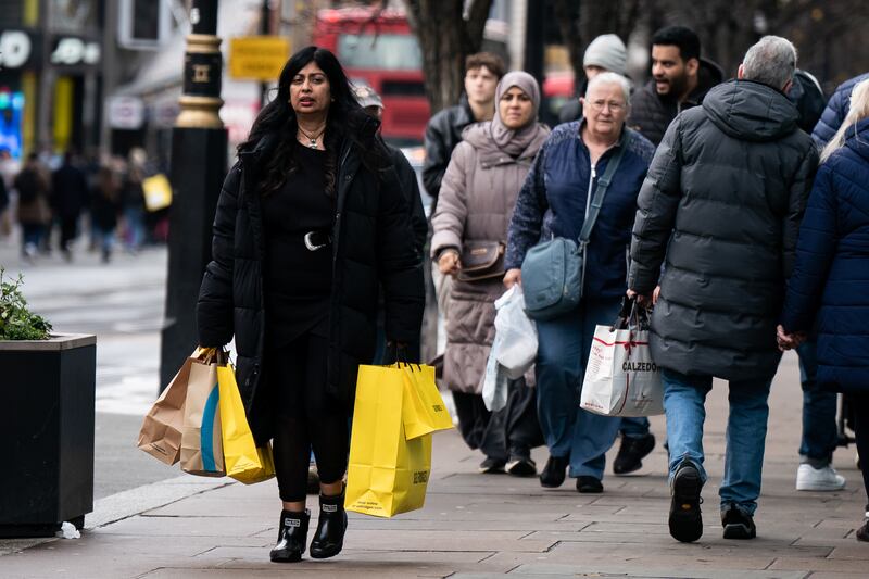 Shoppers on Oxford Street in London. PA
