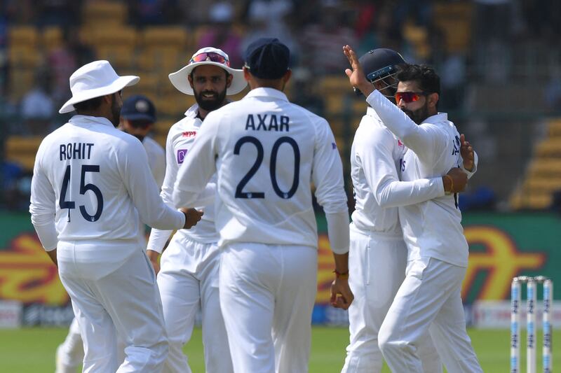 India's Ravindra Jadeja, right, celebrates with teammates after the dismissal of Sri Lanka batter Angelo Mathews for one. AFP