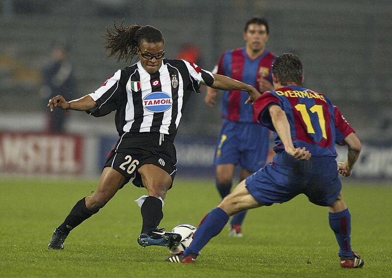 TURIN - APRIL 9:  Edgar Davids of Juventus looks to take the ball past Marc Overmars of Barcelona during the UEFA Champions League quarter-finals first leg match held on April 9, 2003 at the Delle Alpi, in Turin, Italy. The match ended in a 1-1 draw. (Photo by Salvatore Giglio/Grazia Neri/Getty Images)