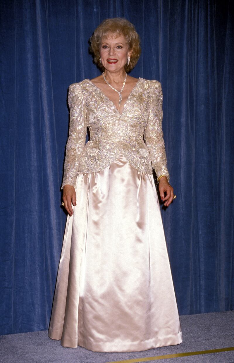 Betty White, in a champagne sequin and satin gown, at the Emmy Awards on September 16, 1990. Getty Images