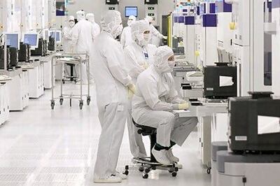 Engineers work in one of several clean rooms at GlobalFoundries in Dresden. The Mubadala-owned company has partnered with Ford to advance semiconductor manufacturing and technology development within the US. Photo: GlobalFoundries