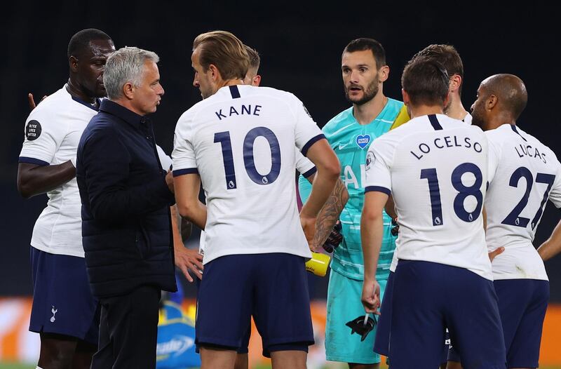 Tottenham manager Jose Mourinho talks to his players during a drinks break. EPA