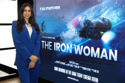 Dana Itani with the poster of her film The Iron Woman in Dubai. Pawan Singh / The National