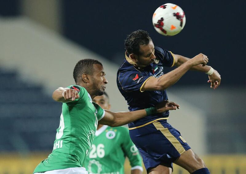 Al Shabab, in green, slumped to a 1-0 loss at Dubai Club in their Arabian Gulf League match at Dubai Sports and Cultural Club Stadium on March 28, 2014. Ashraf Umrah / Al Ittihad