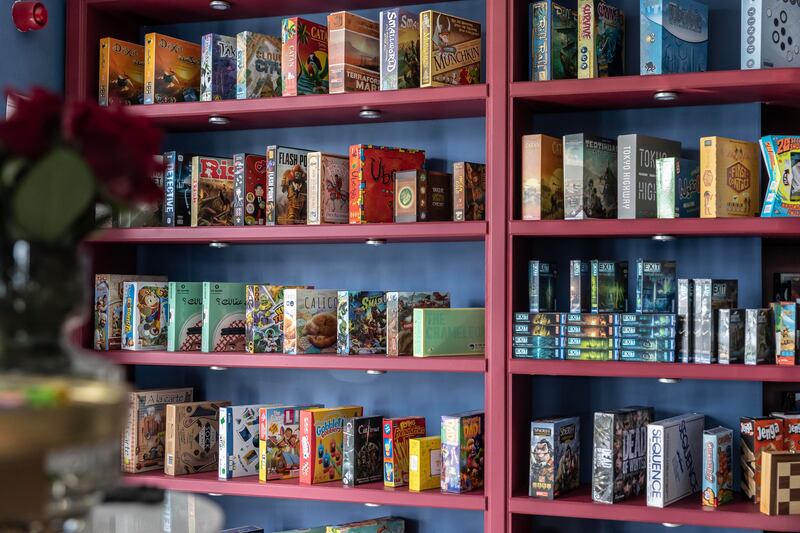 Board games line the walls of the space.