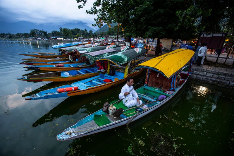 A Kashmiri boatman fishes on the shore of Dal Lake in Srinagar this week. AP Photo