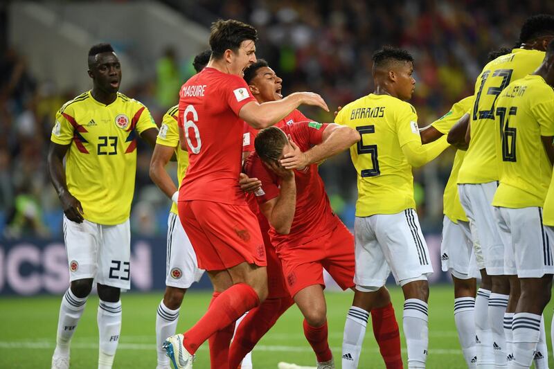 England's Jordan Henderson reacts after Colombia's Wilmar Barrios headbutted him. Matthias Hangst / Getty Images