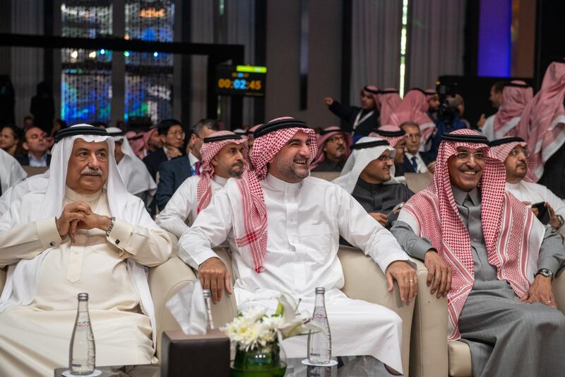 Aramco chairman Yasir Al Rumayyan, centre, and former finance minister Ibrahim Abdulaziz Al Assaf, left.  EPA