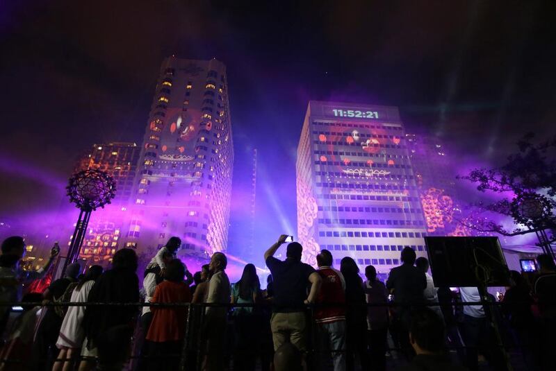 The Philippines celebrates the new year with a laser show in Manila, Philippines on December 31, 2014. Traditionally Filipinos welcome the New Year with firecrackers, fireworks and almost anything to make the loudest noise possible. Bullit Marquez/AP Photo
