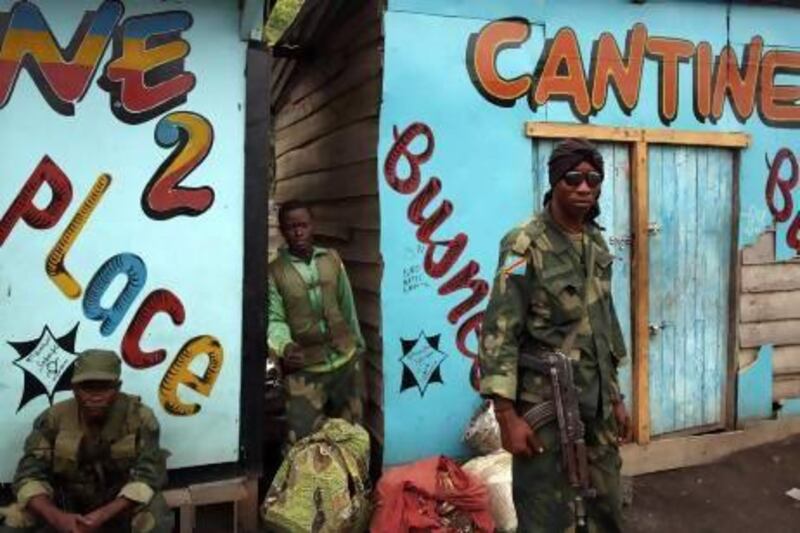 DRC government army soldiers stand in the town of Sake, some 27 kilometres west of Goma.
