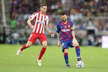 Lionel Messi in action against Atletico Madrid's Saul Niguez at King Abdullah Sport City Stadium, Jeddah. EPA