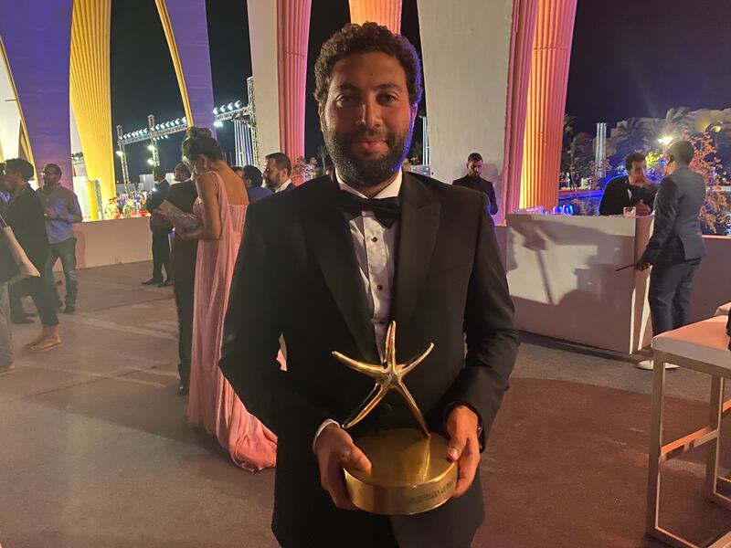 Omar El Zohairy, director of 'Feathers', with his Best Arab Feature Film Award at El Gouna Film Festival. Photo: Nada El Sawy / The National