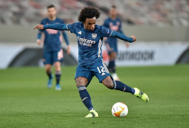 PIRAEUS, GREECE - MARCH 11: Willian of Arsenal takes a shot during the UEFA Europa League Round of 16 First Leg match between Olympiacos and Arsenal at Karaiskakis Stadium on March 11, 2021 in Piraeus, Greece. Sporting stadiums around Europe remain under strict restrictions due to the Coronavirus Pandemic as Government social distancing laws prohibit fans inside venues resulting in games being played behind closed doors. (Photo by Milos Bicanski/Getty Images)