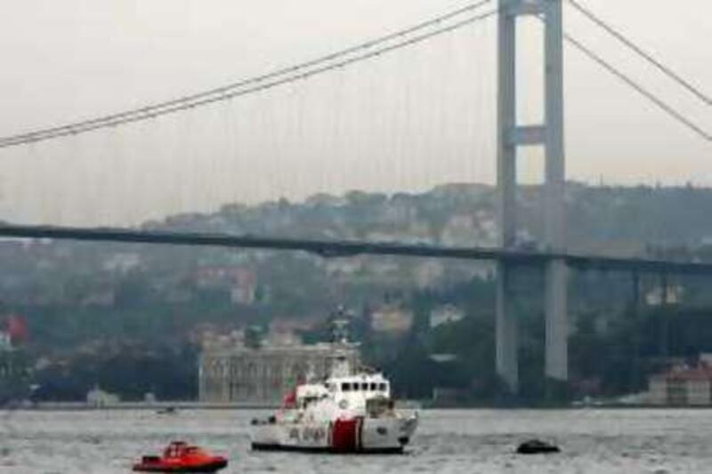 Turkish coast guard boats patrol the Bosphorus straits next to the Bosphorus Bridge during the Iraqi conference held at Ciragan Palace in Istanbul November 3, 2007. Turkey stepped up pressure on the United States to help curb attacks by Kurdish rebels from northern Iraq as a conference on Saturday of Iraq's neighbours and major powers sought to lower cross-border tensions. REUTERS/Fatih Saribas (TURKEY)