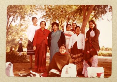 DUBAI , UNITED ARAB EMIRATES , March 27 – 2019 :- One of the old photo of Rosy George (2nd from right ) believed to be the longest serving school teacher ( 40 years ) for the Indian High School in Dubai. She is enjoying with her colleagues at the safa park during the picnic. ( Pawan Singh / The National ) For News. Story by Anna