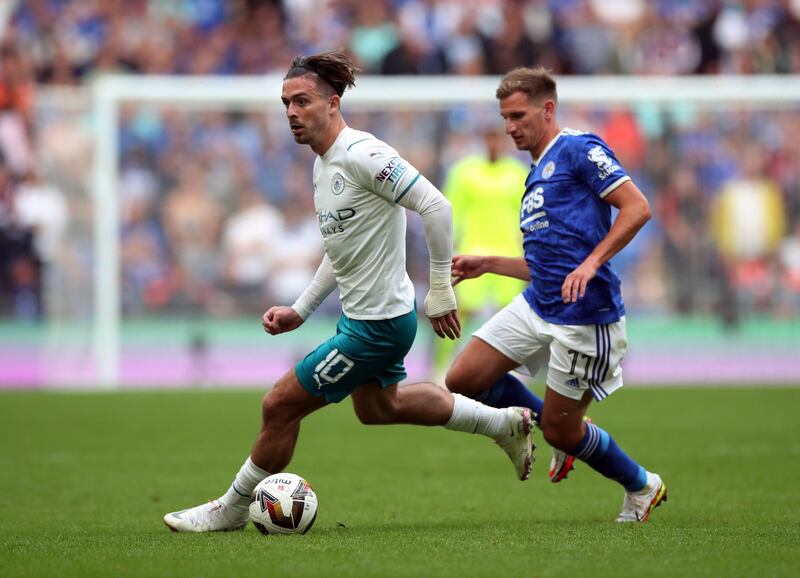 Manchester City's Jack Grealish in action with Leicester City's Marc Albrighton.