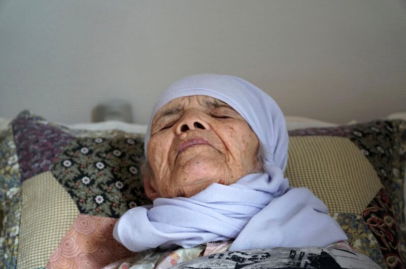 106-year old Afghan refugee Bibihal Uzbeki lies in bed in Hova, Sweden, Sunday, Sept. 3, 2017, and despite being severely disabled and barely able to speak, she is facing deportation from Sweden after her asylum application was rejected. Bibihal Uzbeki made a perilous journey to Europe, carried by her son and grandson through mountains, deserts and forests, but has suffered a debilitating stroke and now faces deportation. (AP Photo/David Keyton)