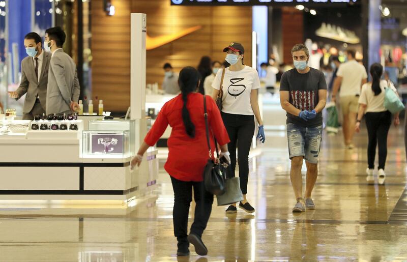 DUBAI, UNITED ARAB EMIRATES , April 29 – 2020 :- Shoppers wearing protective face mask to prevent the spread of the coronavirus at Mall of the Emirates in Dubai. Authorities ease the restriction for the residents in Dubai. At present mall opening timing is 12:00 pm to 10:00 pm. Carrefour timing is 9:00 am to 10:00 pm. (Pawan Singh / The National) For News/Standalone/Online. Story by Patrick