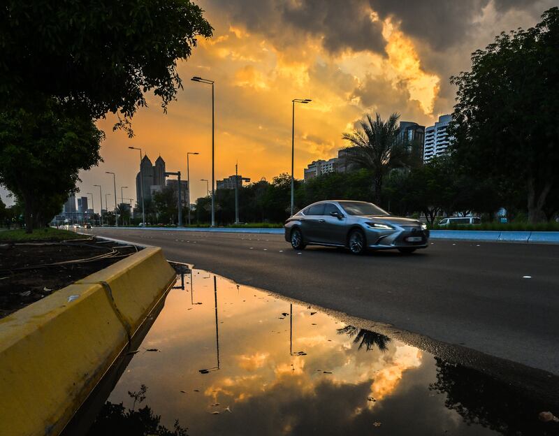 Motorists in Abu Dhabi were advised to maintain a safe distance and avoid pools of water. Victor Besa / The National
