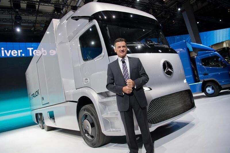 Wolfgang Bernhard, the Daimler Trucks, chairman stands next to an Urban eTruck electric lorry at the IAA Nutzfahrzeuge (IAA Commercial Vehicles) fair in Germany. Julian Startenschulte / AFP