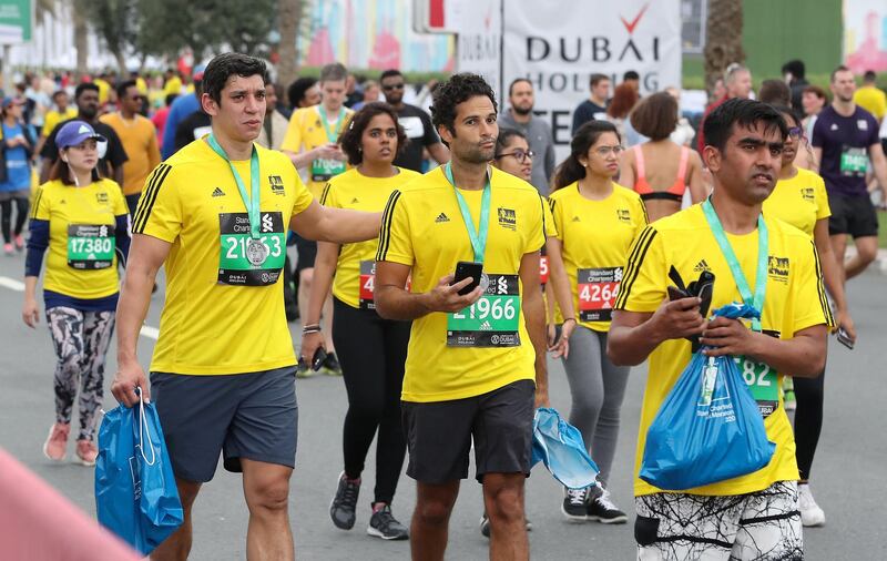 DUBAI, UNITED ARAB EMIRATES , Jan 24  – 2020 :- Participants after taking part in the 10 km road race in the Standard Chartered Dubai Marathon 2020 held on the Umm Suqeim Road in Dubai. ( Pawan  Singh / The National ) For News/Online/Instagram.